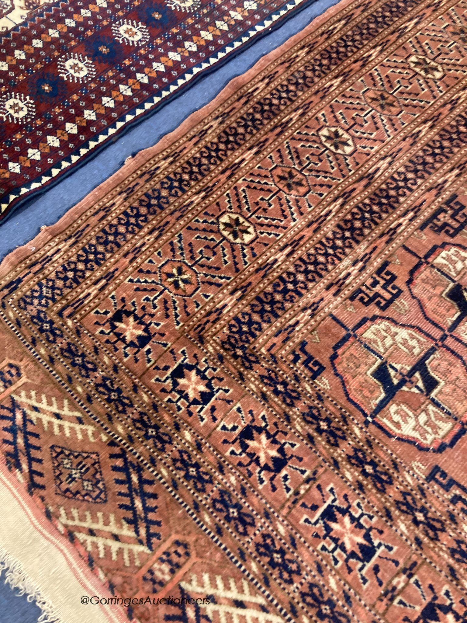 A Bokhara red ground rug, 150 x 116cm